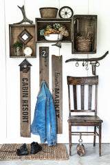 A reclaimed wood farmhouse entry coat hook area, made with Farmer's Market, a stencil by Funky Junk's Old Sign Stencils