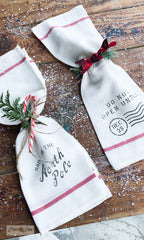 Learn how to make these adorable festive napkins from Ikea tea towels! Made with Christmas Crates by Funky Junk's Old Sign Stencils.