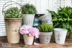 Vintage Crock Numbers by Funky Junk's Old Sign Stencils are number stencils with decorative accents and borders, allowing you to stencil the charming look of a labeled vintage crock onto most any pot desired! Numbers 0-9 are included.